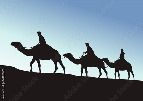 camel caravan going through the desert on beautiful blue sky