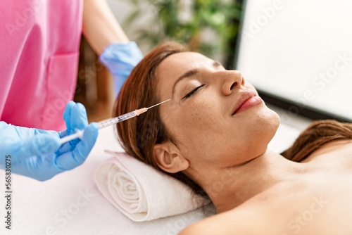 Young latin woman having anti aging treatment