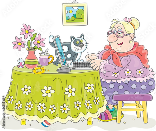 Funny chubby granny and her merry cat sitting at their beautiful kitchen table with a laptop, browsing pages on Internet and chatting with friends in social networks and messengers