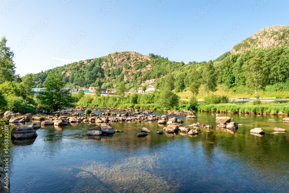 Rocks making a river rocky ford crossing near Algard town, Norway, June 2018