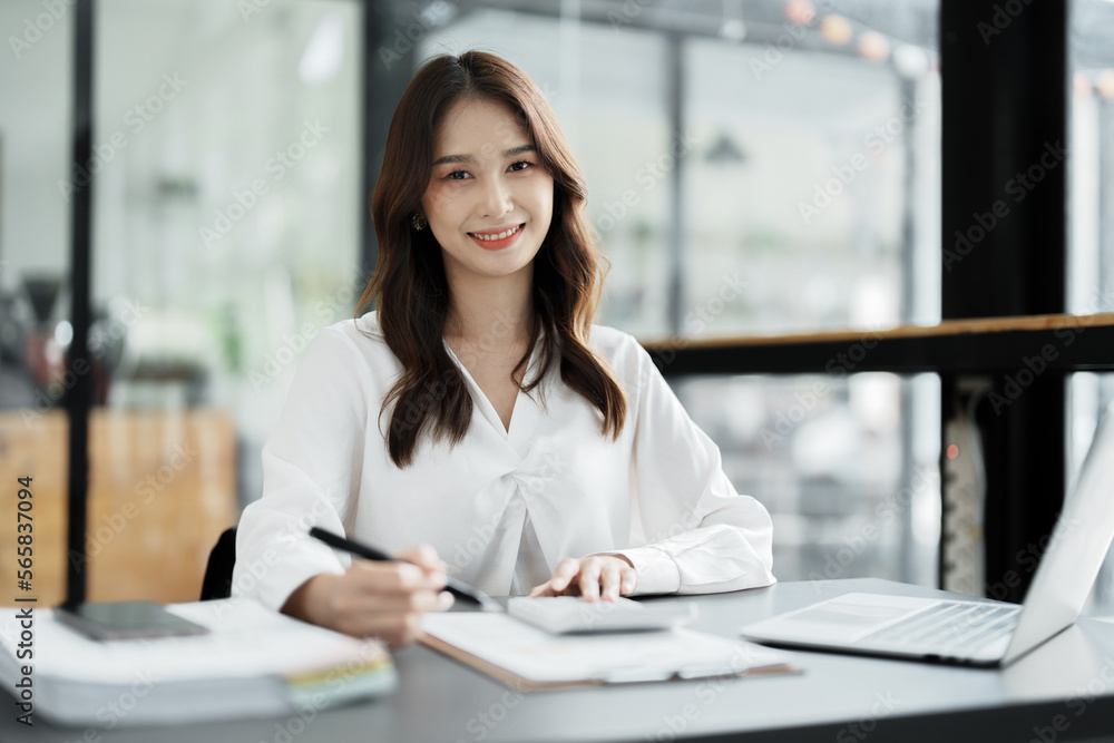 Accountants, Asian auditors are using calculators and computers to review annual tax budgets to submit information to the IRS. Accountants, Asian auditors are using calculators and computers to review annual tax budgets to submit information to the IRS.