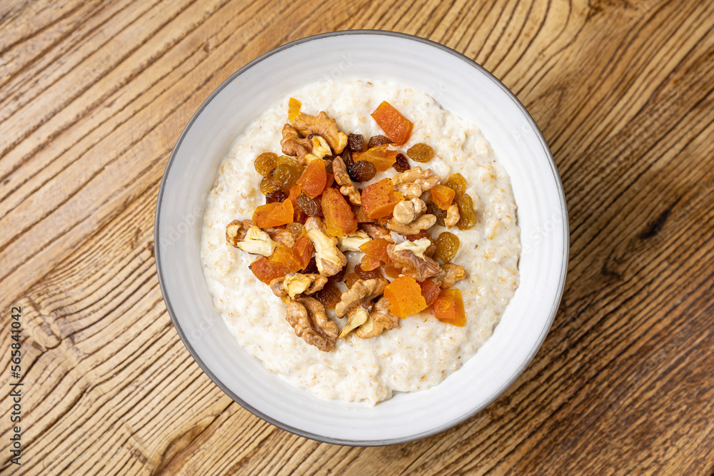 a delicious breakfast on a plate prepared in the restaurant. oatmeal with candied fruit and nuts
a delicious breakfast on a plate prepared in the restaurant. oatmeal with candied fruit and nuts
