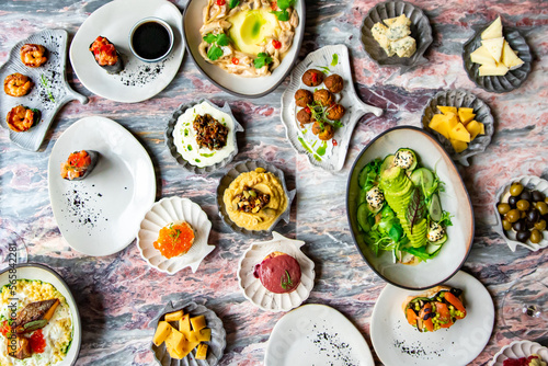 variety of restaurant dishes food on table