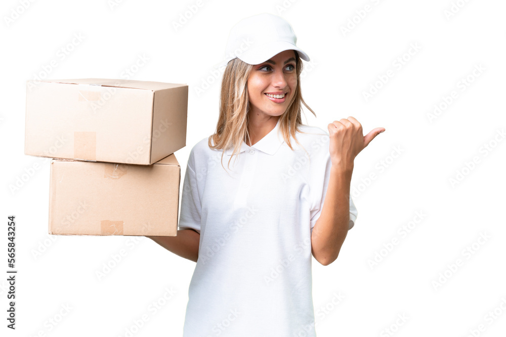 Delivery Uruguayan woman over isolated background pointing to the side to present a product Delivery Uruguayan woman over isolated background pointing to the side to present a product