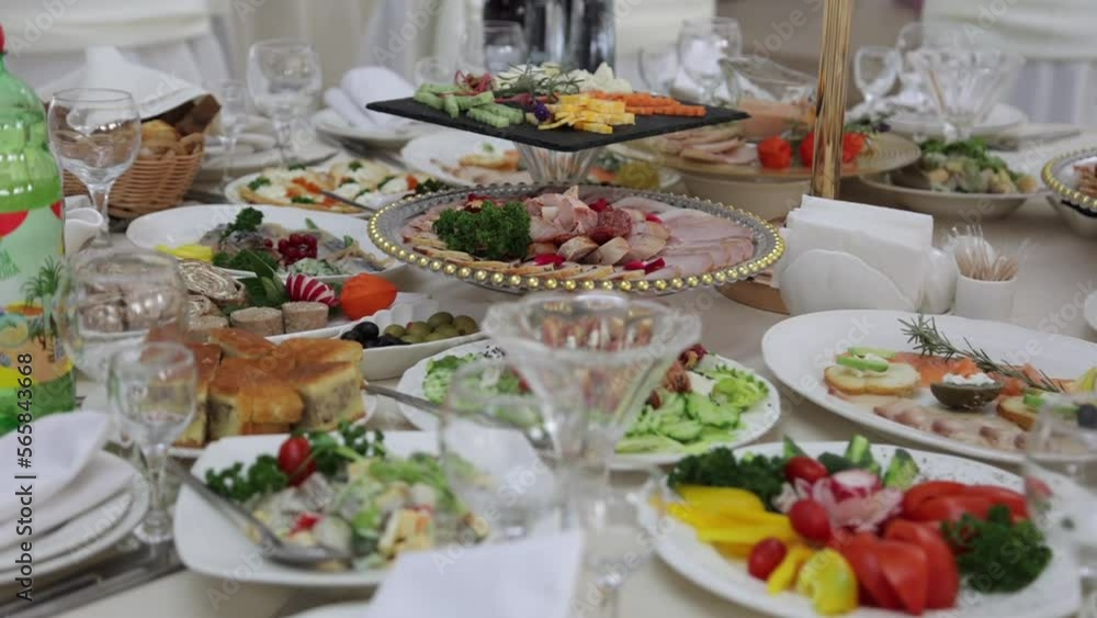 Festive table with delicious dishes. A large selection of dishes, whets the appetite. Wedding in Ukraine Festive table with delicious dishes. A large selection of dishes, whets the appetite. Wedding in Ukraine