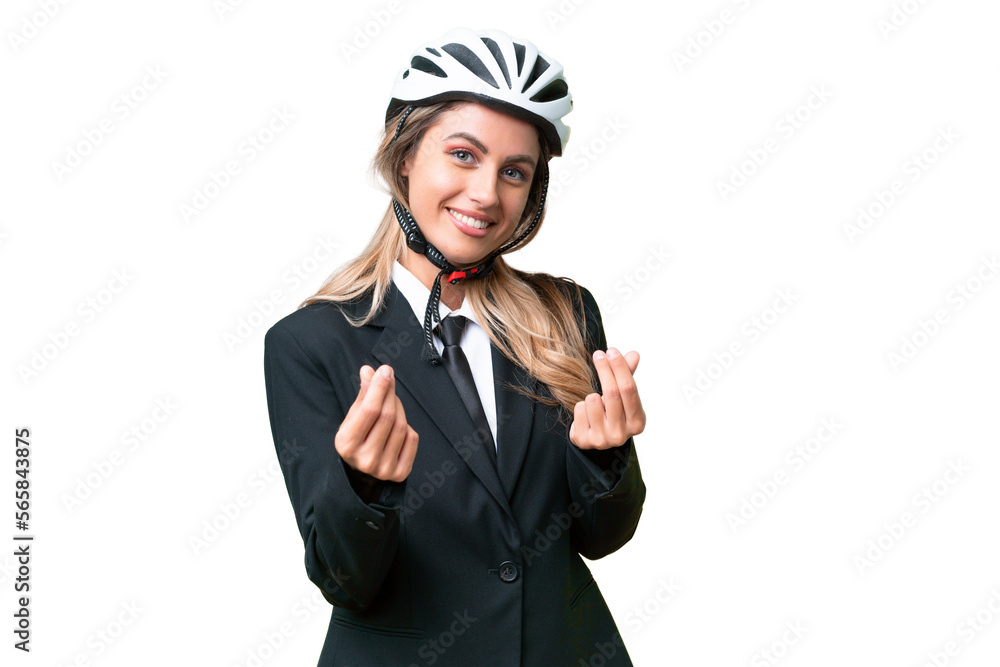 Business Uruguayan woman wearing a helmet biker over isolated background making money gesture Business Uruguayan woman wearing a helmet biker over isolated background making money gesture