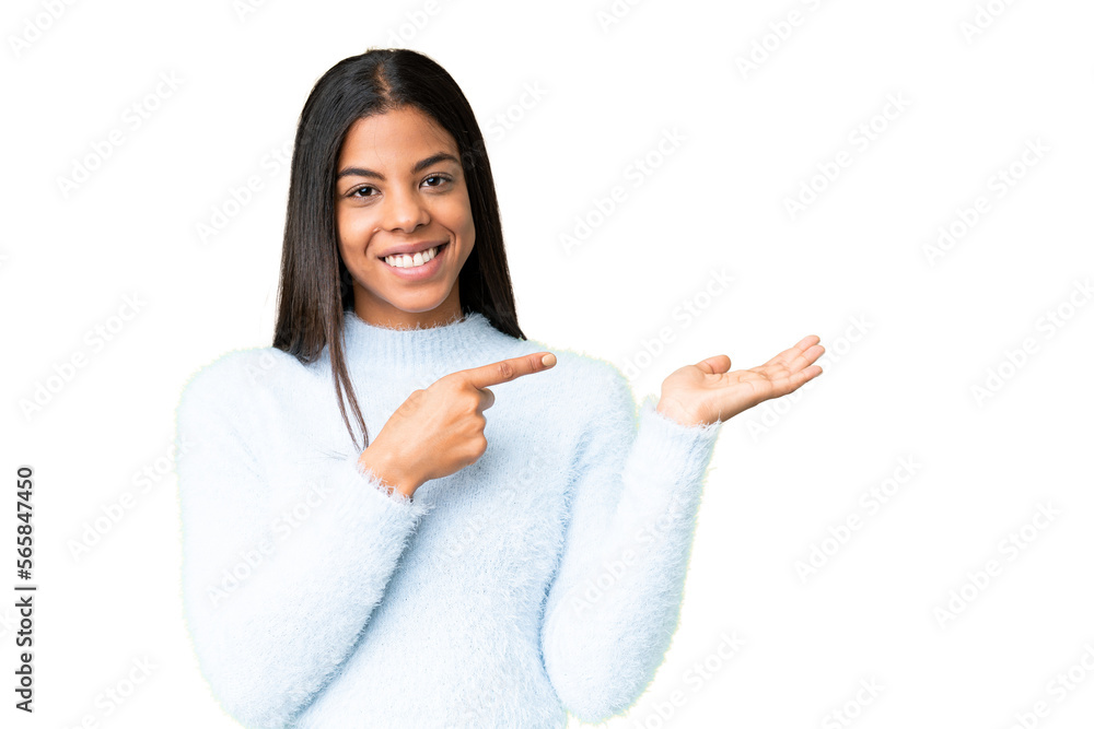 Young African American woman over isolated chroma key background holding copyspace imaginary on the palm to insert an ad Young African American woman over isolated chroma key background holding copyspace imaginary on the palm to insert an ad