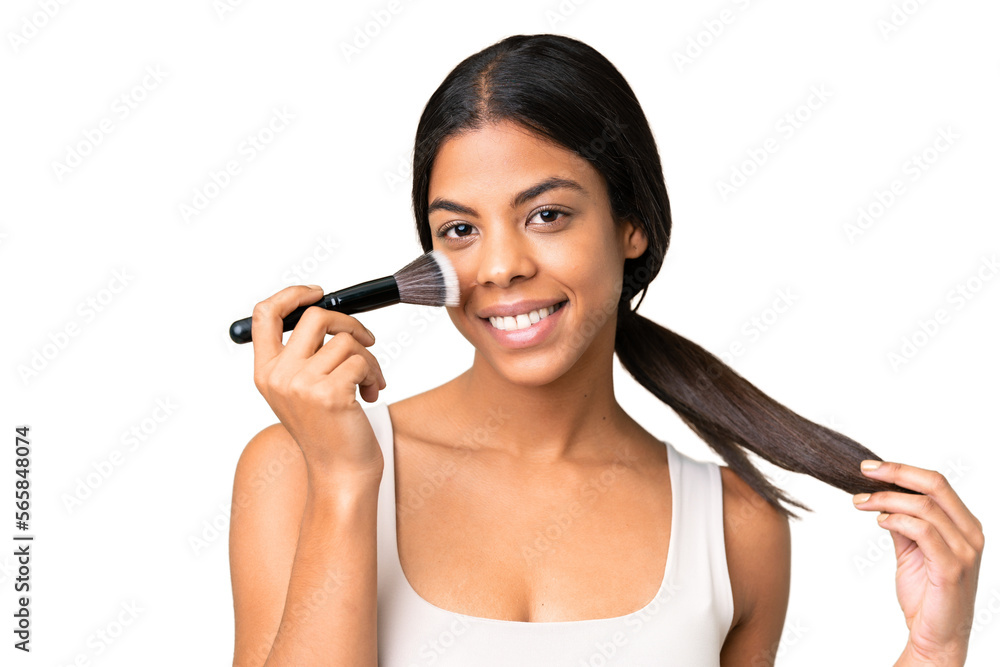 Young woman over over isolated chroma key background holding makeup brush Young woman over over isolated chroma key background holding makeup brush
