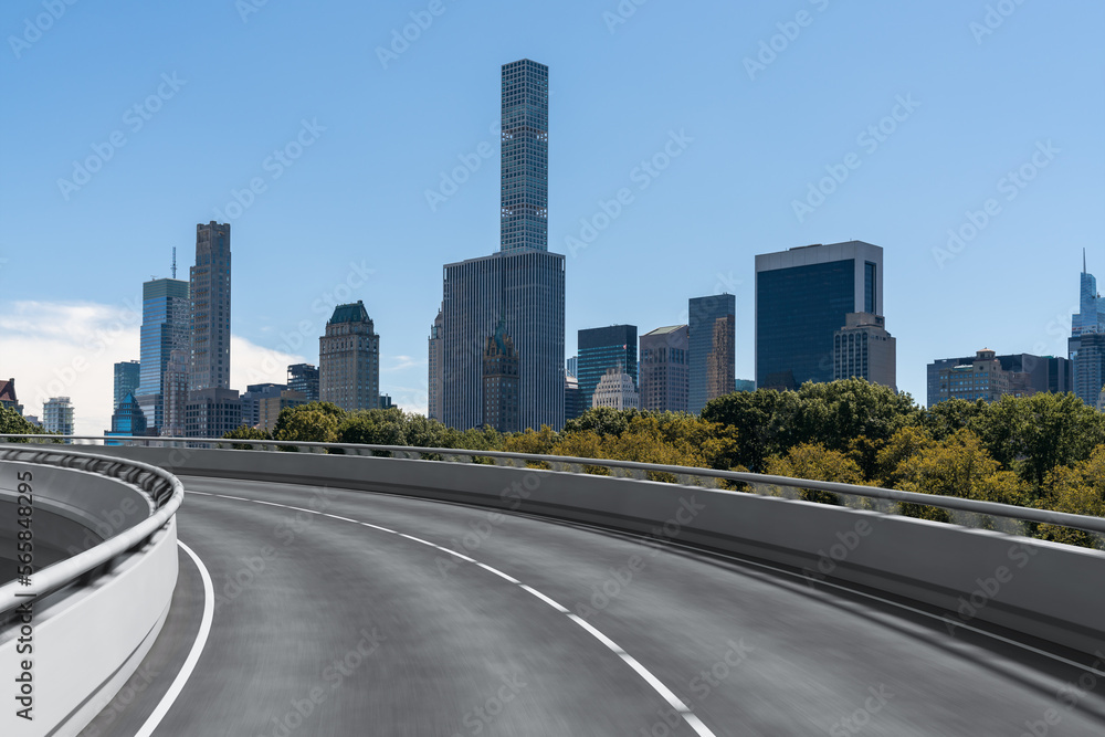 Empty urban asphalt road exterior with city buildings background. New modern highway concrete construction. Concept of way to success. Transportation logistic industry fast delivery. New York. USA.