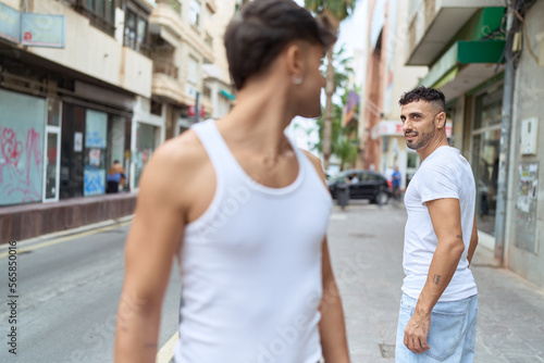 Two hispanic men couple smiling confident standing together at street © Krakenimages.com