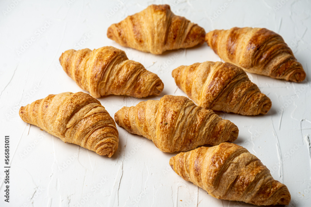 Overhead view of croissants on white table, selective focus, horizontal, with copy space Overhead view of croissants on white table, selective focus, horizontal, with copy space