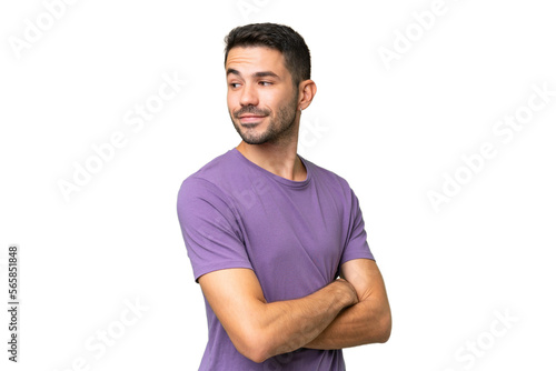 Young handsome caucasian man over isolated background looking to the side and smiling © luismolinero