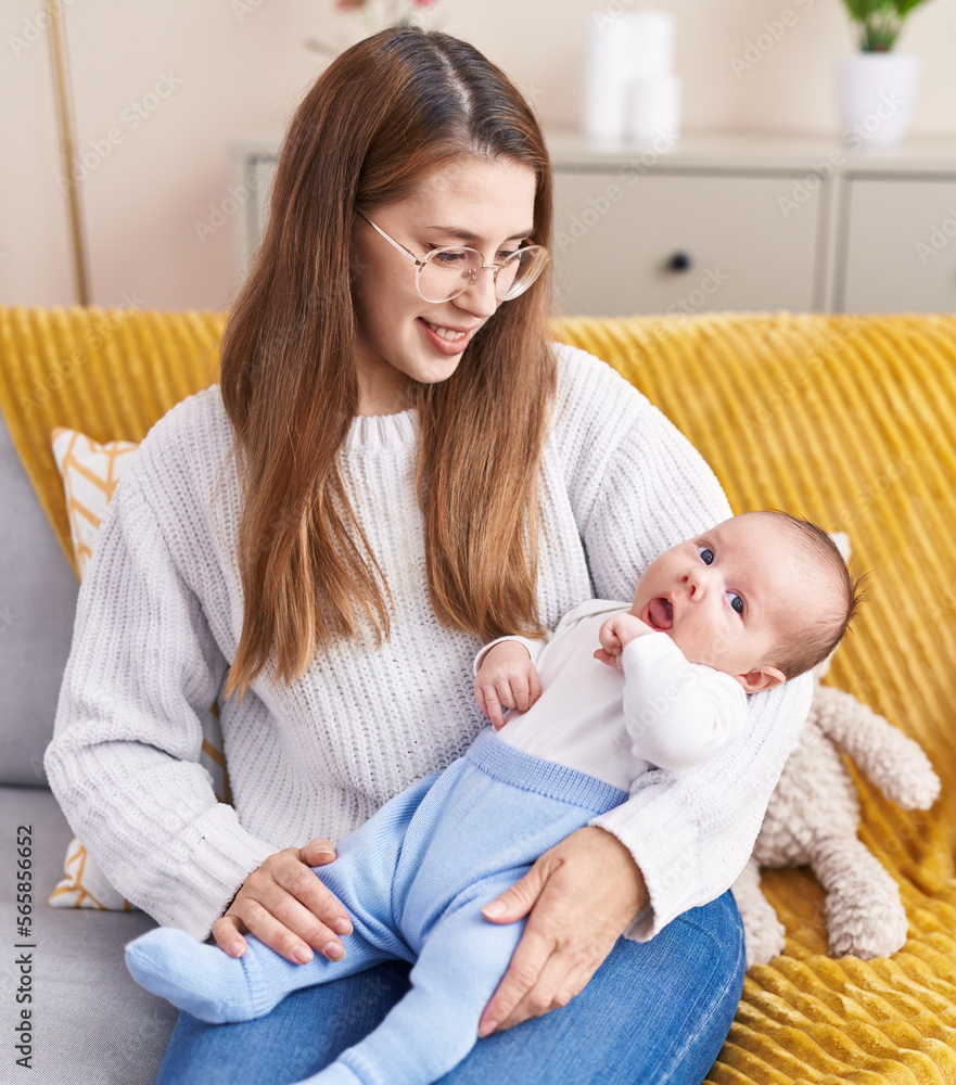 Mother and son smiling confident sitting on sofa at home Mother and son smiling confident sitting on sofa at home