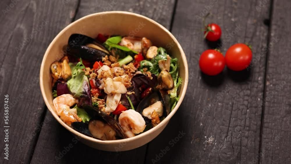 the chef prepares a delicious seafood salad
the chef prepares a delicious seafood salad