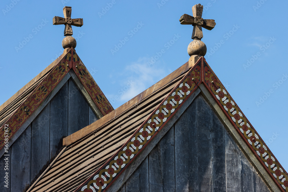 wooden rooftops with artful wood carving ornaments of a viking church. wooden rooftops with artful wood carving ornaments of a viking church.