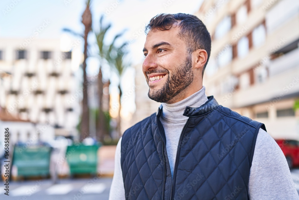Young hispanic man smiling confident standing at street Young hispanic man smiling confident standing at street