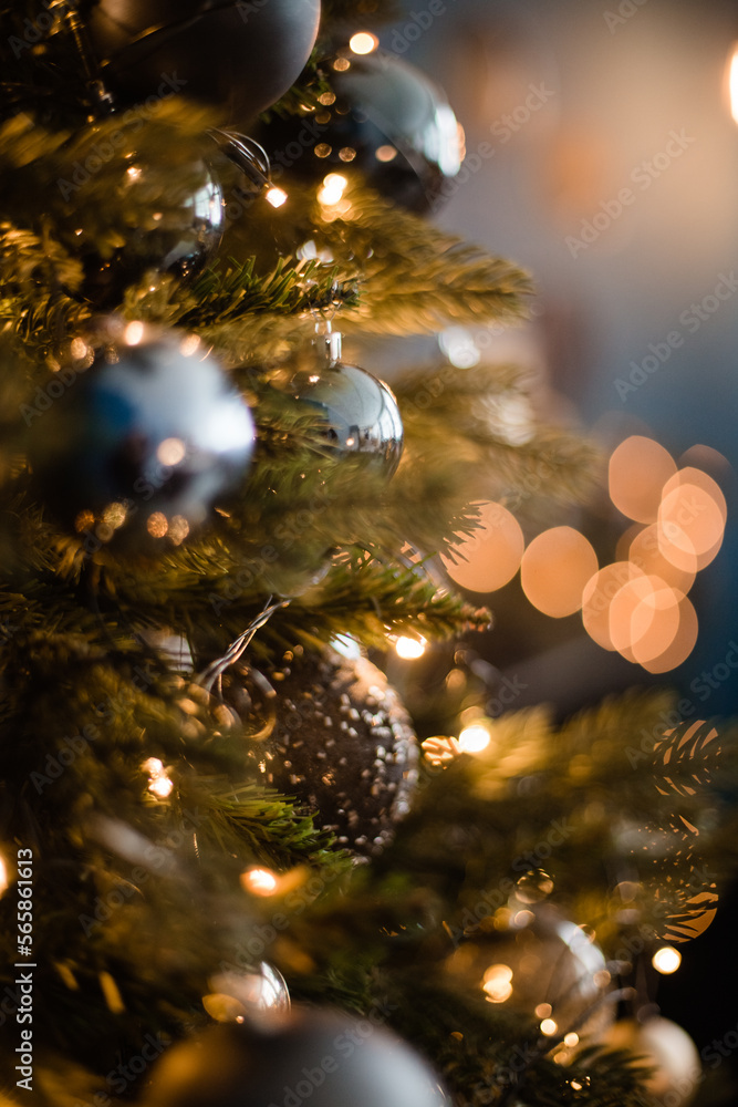 Christmas tree decorated with New Year's toys and sparkling garlands for Christmas. New Year 2024 Christmas tree decorated with New Year's toys and sparkling garlands for Christmas. New Year 2024