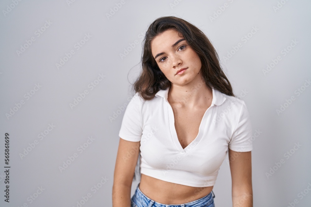 Young teenager girl standing over white background looking sleepy and tired, exhausted for fatigue and hangover, lazy eyes in the morning. Young teenager girl standing over white background looking sleepy and tired, exhausted for fatigue and hangover, lazy eyes in the morning.