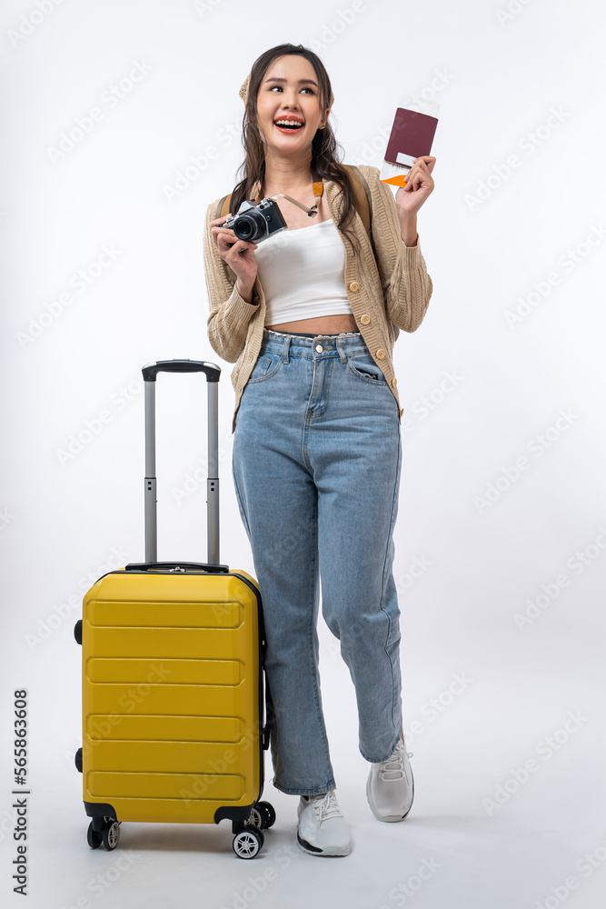 Happy Asian woman traveler with luggage, camera, passport and boarding pass ticket isolated on white background, Tourist girl having cheerful holiday trip concept. Happy Asian woman traveler with luggage, camera, passport and boarding pass ticket isolated on white background, Tourist girl having cheerful holiday trip concept.