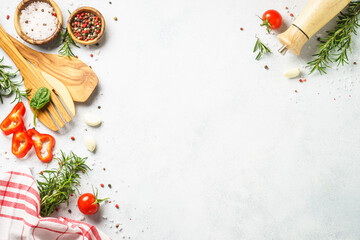 Food background with spices, herbs and utensil on white background.