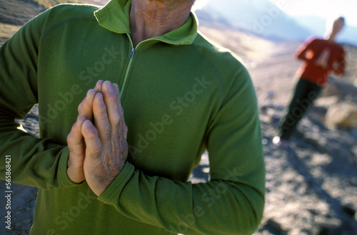 Retired couple performing Yoga together in Owen's Valley, California. photo