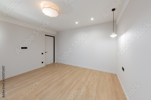 clean large bright room with white walls and lighting