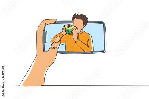 Continuous one line drawing male food blogger eating burger while creating new video for his live stream channel with smartphone. Food concept. Gastronomy. Single line draw design vector illustration