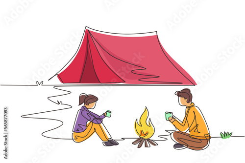 Single continuous line drawing camping or hiking couple around campfire tents. Man woman sitting on ground and drinking hot tea getting warm near bonfire. One line draw design vector illustration