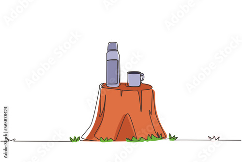 Single continuous line drawing thermos mug with hot drink on log table. Steam comes from the mug. Vacuum thermos stands on tree stump in the wild. One line draw graphic design vector illustration