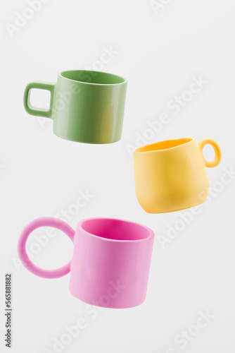 Mockups of three multicolored handmade clay flying cups on white background.
