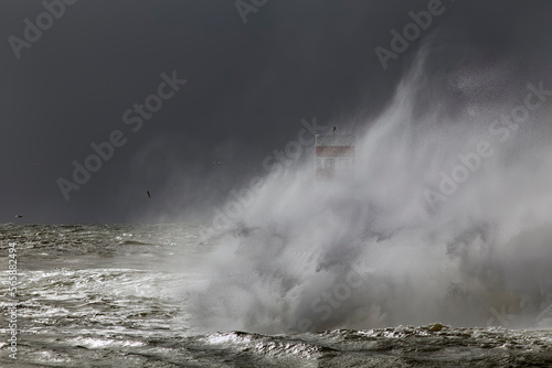 River mouth beacon and pier under heavy storm