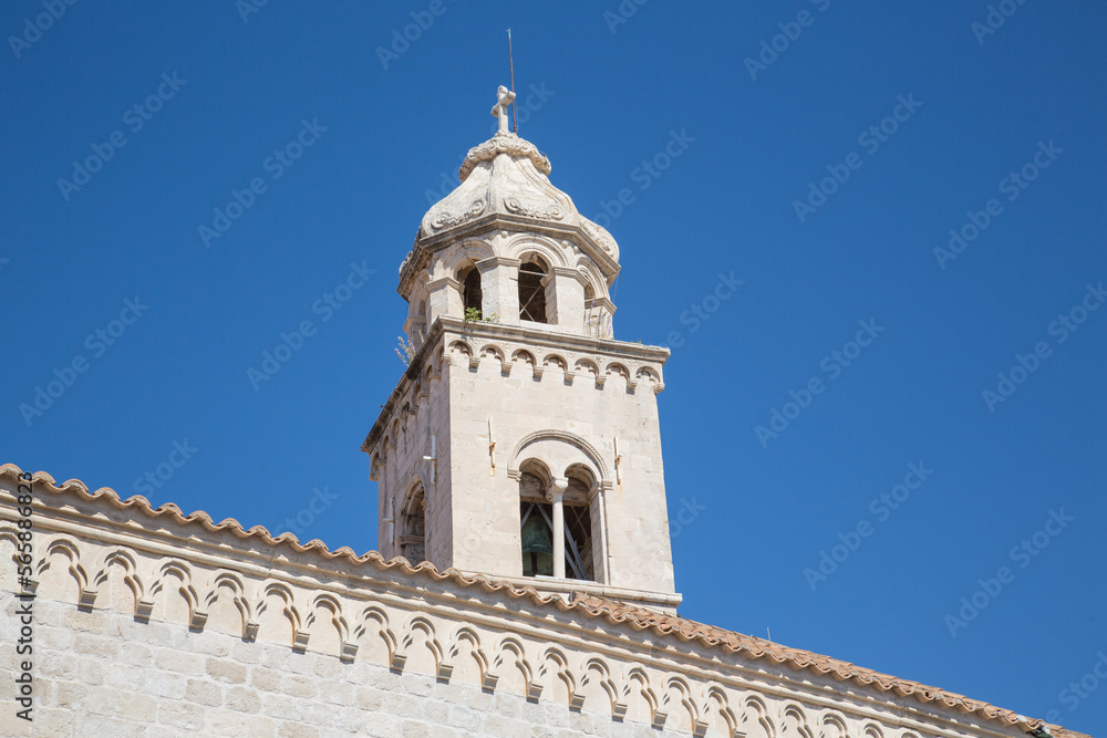 Dome and bell tower of the church and Dominican monastery with its gothic facade and stone architecture in Dubrovnik, Croatia - detail, close up