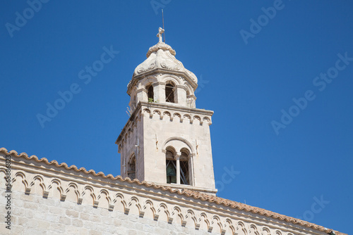 Dome and bell tower of the church and Dominican monastery with its gothic facade and stone architecture in Dubrovnik, Croatia - detail, close up © blickwinkel2511