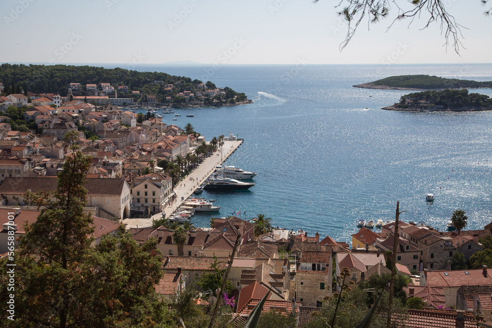 Panorama view from the ancient Spanish Fortress to the harbor with its promenade, the old town of Hvar, Croatia and the Pakleni Islands