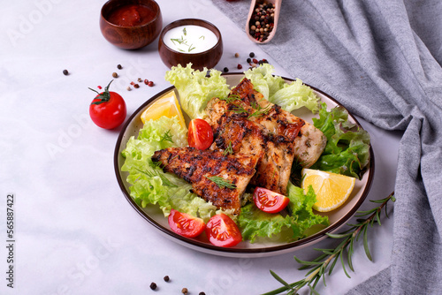 Grilled sturgeon pieces served with fresh lettuce, cherry tomato, lemon and two sauces. Exquisite fish meal