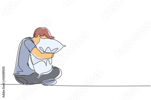 Single continuous line drawing man sitting and hugging pillow. Sleeping young male hugs or holding pillow or overslept to work. Sweet dream or sleep concept. One line draw design vector illustration