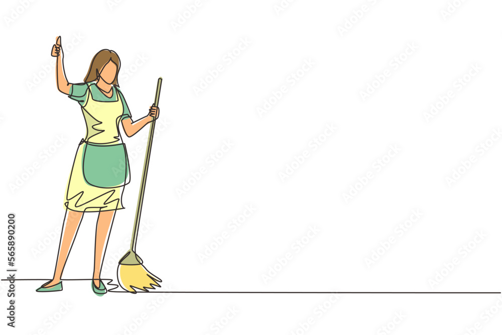 Fototapeta premium Single one line drawing smiling female cleaning company staff member holding broom and showing thumbs up gesture. Happy cleaning. Cleaning company. Continuous line draw design vector illustration
