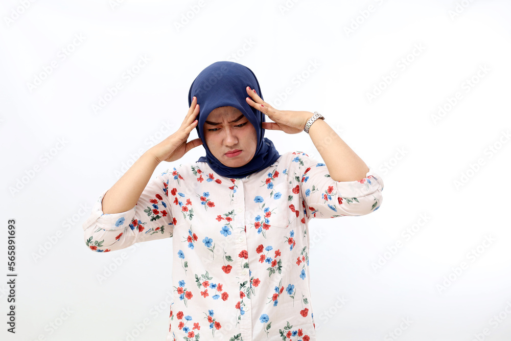 Fototapeta premium Asian muslim woman suffering from head ache. Hand holding head. Isolated on white background