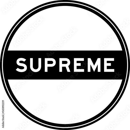 Black color round seal sticker in word supreme on white background