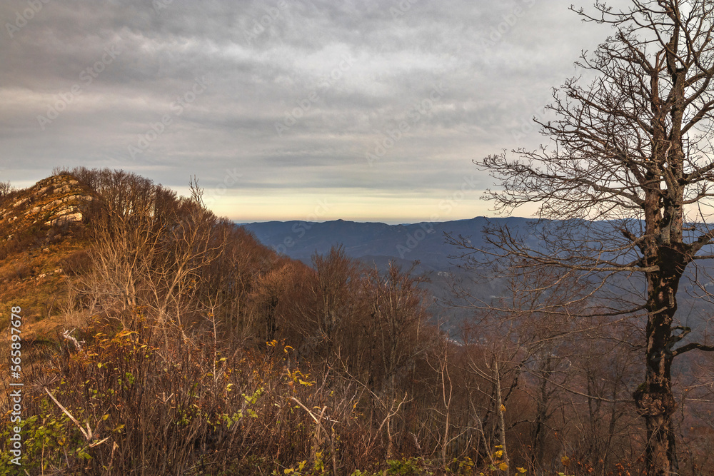 Picturesque view of the peaks of the Caucasus mountains on a sunny day with blue sky and dramatic clouds. Picturesque view of the peaks of the Caucasus mountains on a sunny day with blue sky and dramatic clouds.