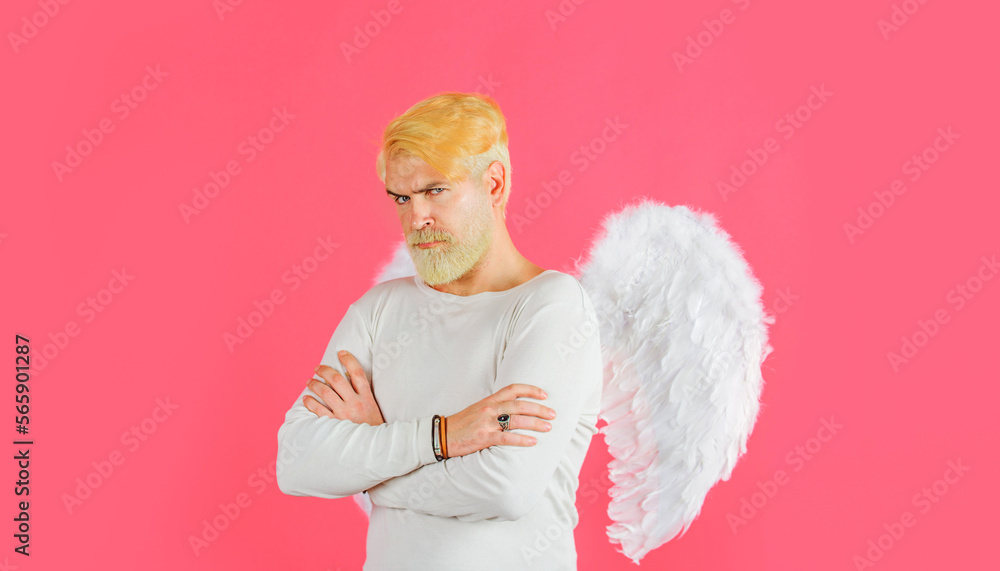 Valentines Day. Bearded man in angel wings with folded hands. Cupid in valentine day. Love concept. Valentines Day. Bearded man in angel wings with folded hands. Cupid in valentine day. Love concept.