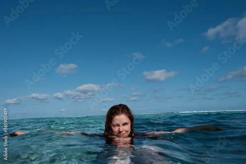 Smiling portrait of beautiful woman in the ocean © Make_story Studio