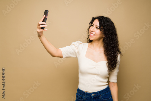 Attractive woman smiling taking a selfie
