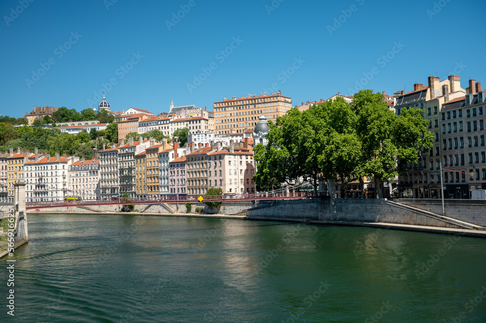 Tourist destination, views of Rhone river, streets, houses, cafes in old central part of Lyon in summer, France
