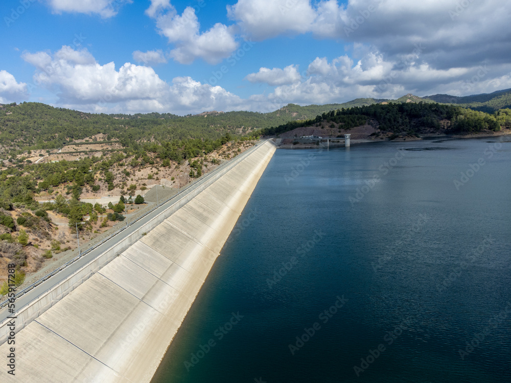 Aerial view on freshwater lake with dam for irrigation and drinking in centre of dry, sunny Cyprus island