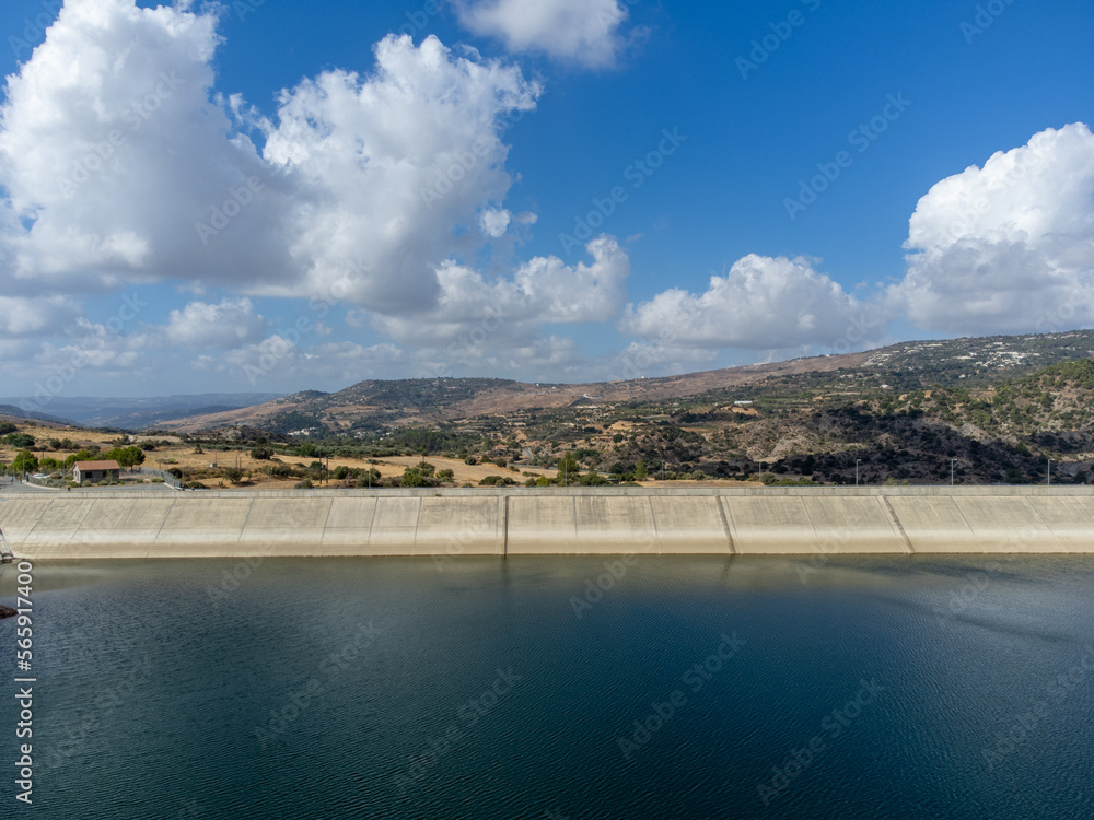 Aerial view on freshwater lake with dam for irrigation and drinking in centre of dry, sunny Cyprus island