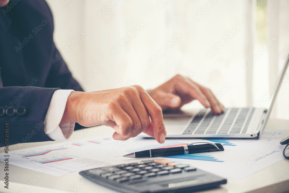 Close up man hands Asian businessman calculating number, audit planning on business report Asian Business man hands using calculator counting tax financial bill. Tax audit Finacial concept Close up man hands Asian businessman calculating number, audit planning on business report Asian Business man hands using calculator counting tax financial bill. Tax audit Finacial concept