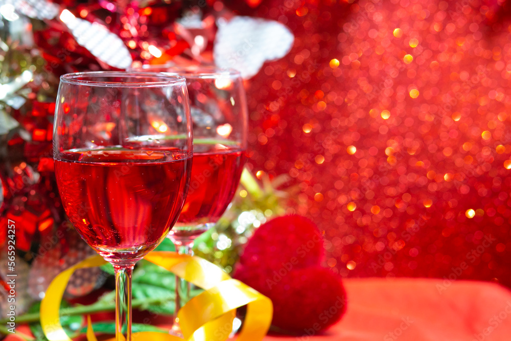 Champagne on red bokeh background. a wedding or valentine's Day concept with space for text. Champagne on red bokeh background. a wedding or valentine's Day concept with space for text.