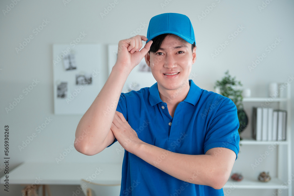 An Asian young Technician service man wearing blue uniform checking electrical appliances in home An Asian young Technician service man wearing blue uniform checking electrical appliances in home