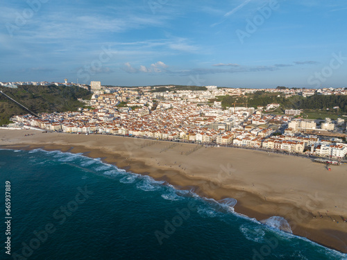 Fototapeta Naklejka Na Ścianę i Meble -  Nazare Town in Portugal. Beach and Cityscape. Drone Point of view.